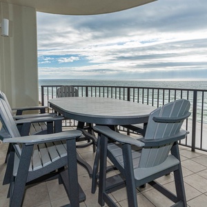 Savor meals or drinks on the spacious balcony with comfortable seating and views of the tranquil waters beyond