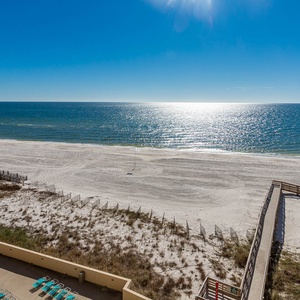 Enjoy a stunning view of the sparkling coastline from a spacious balcony, perfect for relaxing in the sun