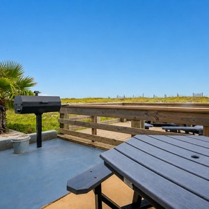 Fire up the grill and enjoy a delicious meal with the beautiful beach just steps away