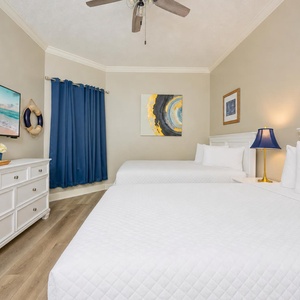 Unwind in this queen guest suite and stream your favorite shows or enjoy a good movie after a beach day