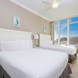 Relax on one of the cozy queen beds in this guest suite with stunning views and enjoy a peaceful slumber