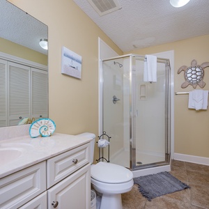 Refresh in this additional guest bath with a walk-in shower and laundry area with a washer and dryer in your rental