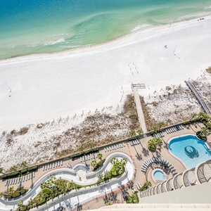 Discover the refreshing pool area with gradual entry, indoor hot tubs and pool, lazy river, and waterslide