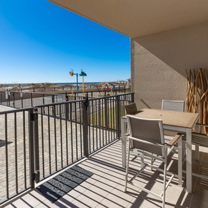 Savor meals at the outdoor dining set while enjoying views of the beach and nearby splash park