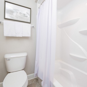 Invigorate your mornings in the guest bathroom, enjoying refreshing showers and soft towels