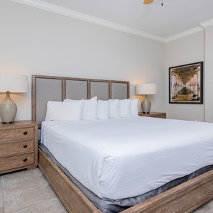 Retreat to the guest suite with a king bed, where the plush bedding and coastal decor invites restful nights