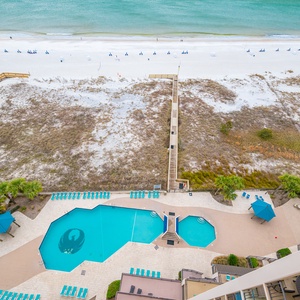 Bask in the sun by the shimmering pool, while planning your next beach adventure just steps away