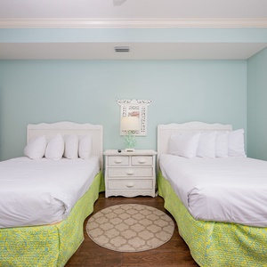 Relax in the cozy double beds in this guest suite with an additional twin ottoman