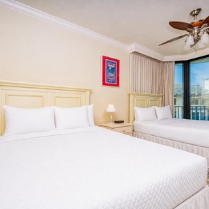 Relax on one of the cozy queen beds in this guest suite and enjoy a peaceful slumber