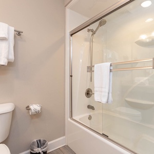 Freshen up in this guest bath in the relaxing shower or soothing tub before an exciting beach day