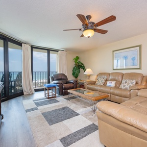 Unwind in the inviting living room, cozied up on the sofa while enjoying views of the beach
