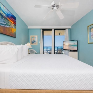 Cerulean walls surround your king master suite where restful sleep follows peaceful balcony views