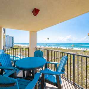 Relax on your balcony's chairs while soaking in the stunning views of the beach