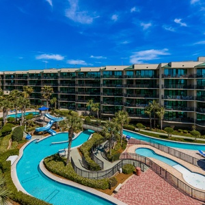Relax by the sparkling pools and enjoy the vibrant bay view from your balcony in this family-friendly resort