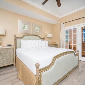 Experience restful nights in this serene king master suite, featuring plush bedding and elegant decor