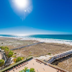 Breathe in the fresh coastal air from your spacious balcony, soaking in the inviting view of the beach below