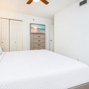 Unwind in the plush king bed, enjoying a restful night surrounded by inviting decor and a cozy vibe