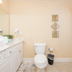 Guest bathroom featuring a spacious vanity, plush towels, and a clean tub/shower combo for a refreshing experience