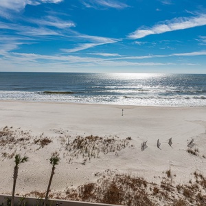 Enjoy stunning balcony views with soft sandy shores and gentle waves, perfect for a relaxing getaway