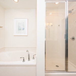 Indulge in relaxation with a spacious soaking tub and a separate walk-in shower in the master bath