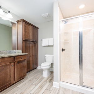 Revitalize in the guest bathroom, where a sleek shower invites relaxation after beach adventures
