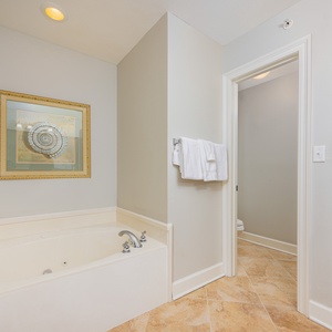 Unwind in the luxurious jetted tub in the guest bath, perfect for refreshing relaxation after beach adventures