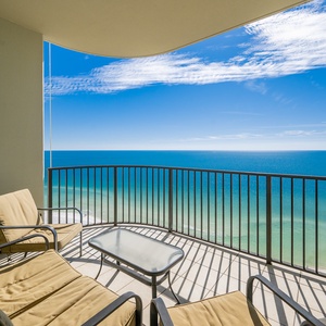 Lounge on your balcony chairs, embracing the coastal views and gentle waves as you soak in the beach vibe