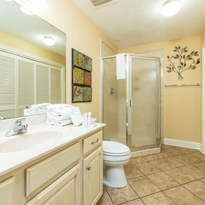 Refresh in this additional guest bath with a walk-in shower and laundry area with a washer and dryer