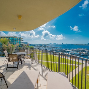 Relax on the sunlit balcony, soaking in the gentle breeze and enchanting bay views as you unwind