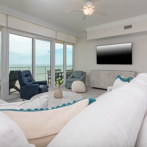 Relax on the cozy sofa with queen sleeper and enjoy gulf views through the living room's balcony windows