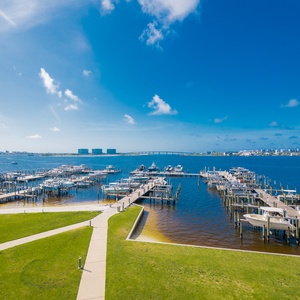Gaze out at the serene marina as you soak up the coastal sun from your relaxing bayfront retreat