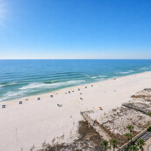 Sunny beach vista with boardwalk