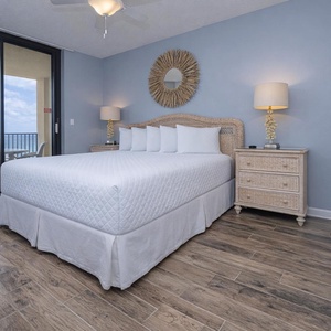 Retreat to the king master suite with cozy bedding and drift off to the sound of the waves from the balcony