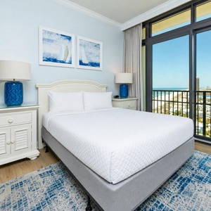 Escape to your serene guest suite, where the plush queen bedding invites restful nights with coastal sounds