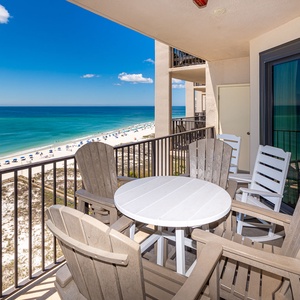 Seats surround your balcony table where you will be sharing snacks and stories while watching the coastline below