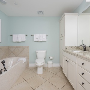 Indulge in a relaxing soak in the jetted tub in the master bath, surrounded by soft towels for ultimate comfort