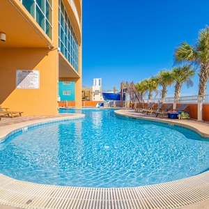 Relax by the pool with a view of the beach and enjoy the fun waterslide perfect for making your family getaway a splash