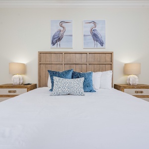 Drift into comfort on the king bed, enveloped in soothing decor, perfect for restful nights in this guest room