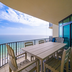 Relax at your balcony table, savoring the coastal views while creating lasting family memories in this inviting space