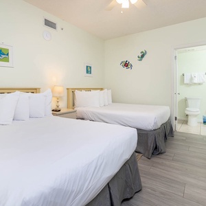 Relax in this guest room with two comfortable double beds, cheerful decor, and a welcoming atmosphere for restful nights