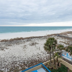 Breathe in the fresh air while enjoying views of the tranquil shoreline and gentle waves from your balcony