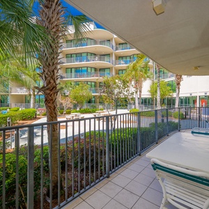 Savor tranquil moments on the balcony, soaking in the landscaped views and gentle breezes of the coastal retreat