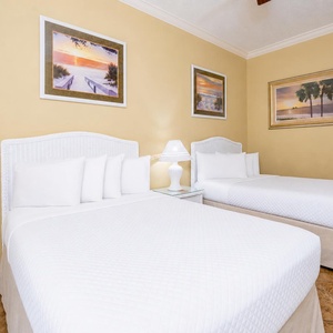 Drift into restful nights on plush double beds in this guest suite, surrounded by serene coastal accents