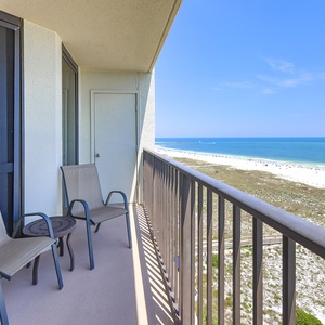 Balcony seating offers a serene view of the beach and vibrant gulf waters, perfect for relaxation and enjoying the outdoors