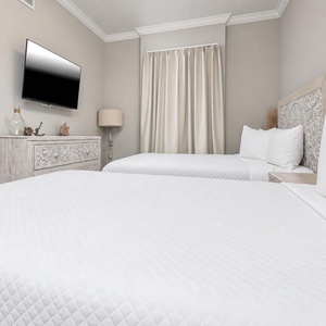Unwind in this queen guest suite and stream your favorite shows or enjoy a good movie after a beach day