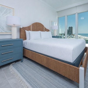 Drift to sleep on the bed while the windows showcase stunning coastline views in this king guest suite