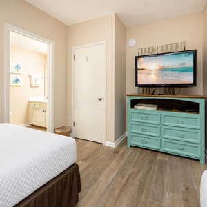 Your guest suite invites restful nights with two doubles and a TV for cozy entertainment