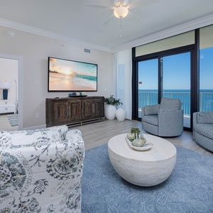Relax in the inviting living area, featuring comfortable seating queen sofa sleeper, and stunning beachfront views
