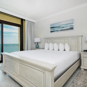 Experience restful nights in this king master suite and drift off with the sound of the waves from the balcony