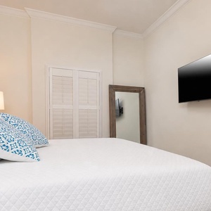 Rest on the fluffy king bed, switch on the TV, and unwind after a day at the beach